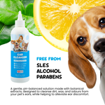 Pet ear cleanser bottle with a dog's face and lemon slice on a white background