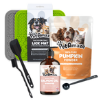 Collection of PetAmaze pet care products including a lick mat, pumpkin powder, salmon oil, and accessories on a white background.