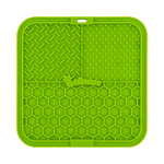 Green silicone mat with textured surface on a white background 